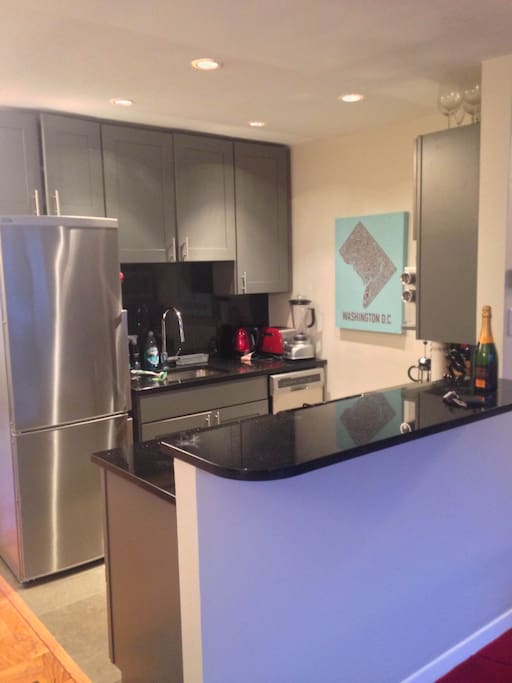 Recently remodeled kitchen with stainless steel appliances, granite countertops and oven gas range.