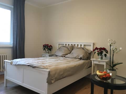 Big bright room in green area with tea & coffee