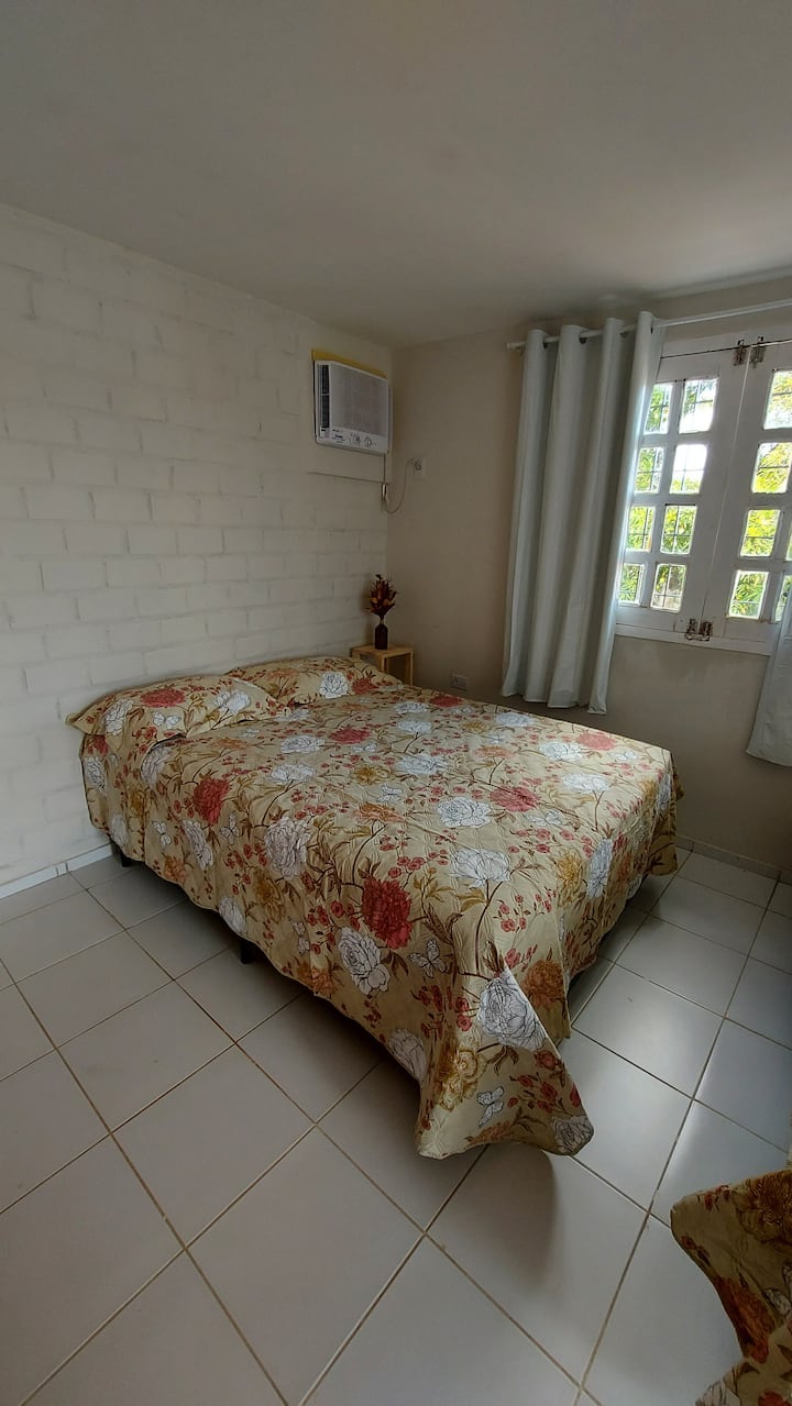 Bedroom 1 (suite) - 1 double bed, 2 single beds, dresser, air conditioning and black-out curtain