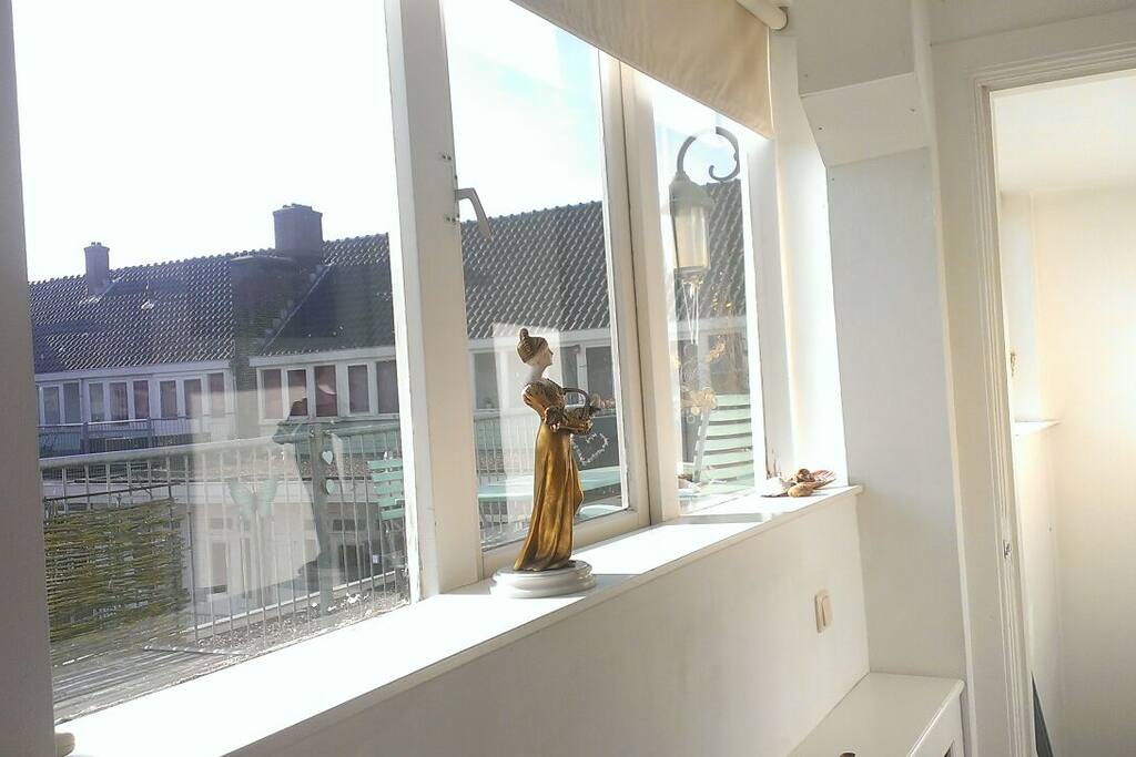 The window as soon as you enter the room.