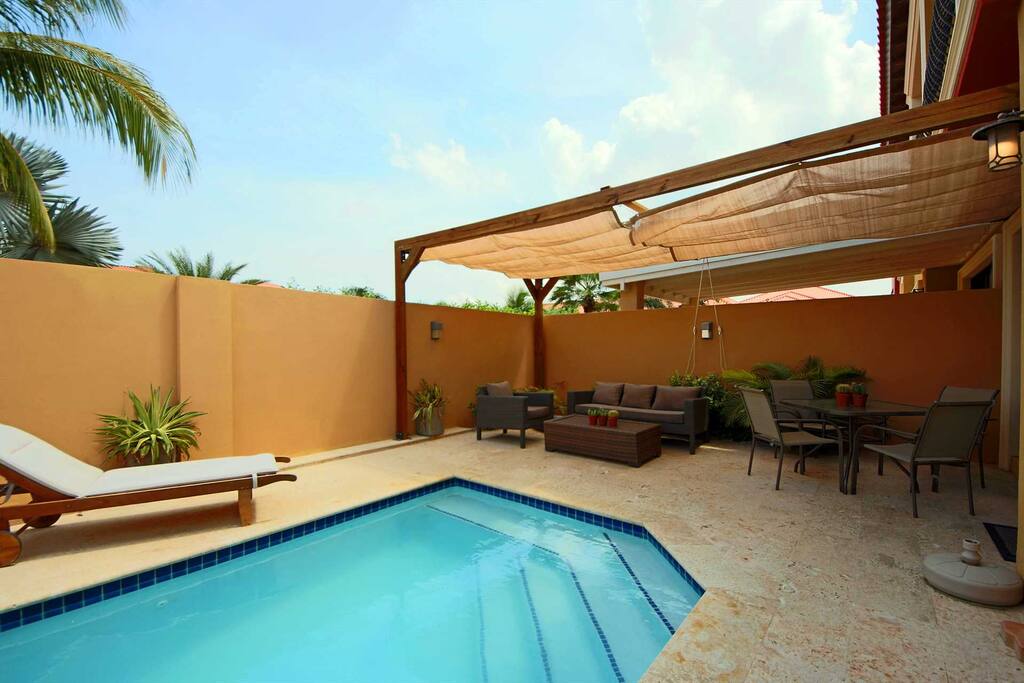 Private swimming pool and shaded seating area