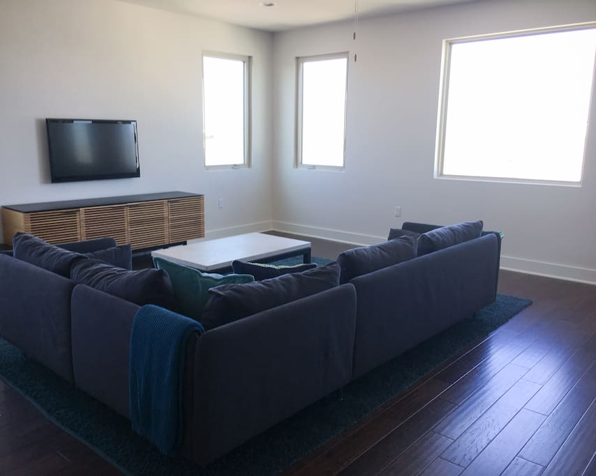 The living room has a TV with Apple TV and XBOX.