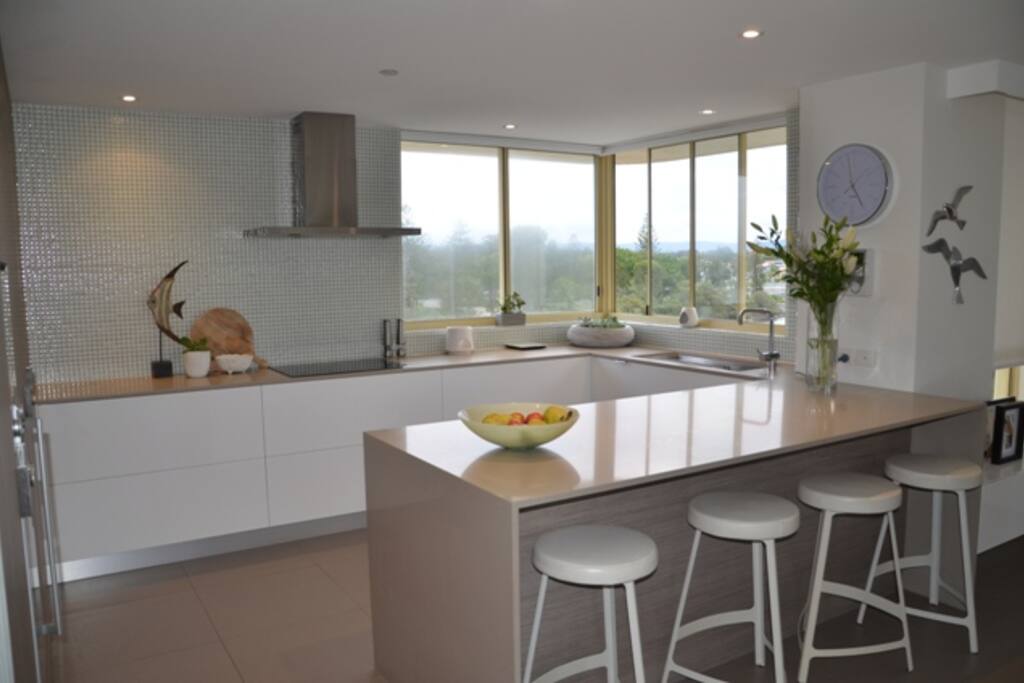 Kitchen with breakfast bar and views!