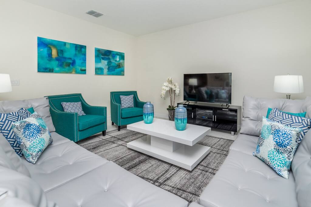 Modern living room with sectional sofa and flat screen TV