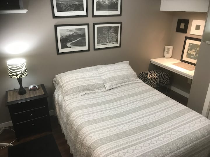 Your bedroom has everything you could need for a short stay or a longer one. There is a desk, a dresser, closet equipped with hangers and ample extra bedding. 