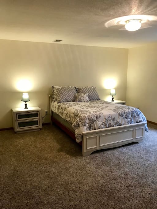 Open room with comfortable bed