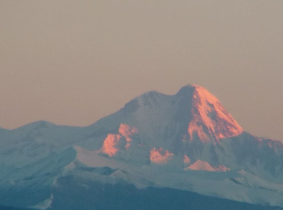 March 6, 7:30 a.m. Mount Kazbek (5047m) just in front of you (100 km from your window)! Looks like you can spot the climber over there... Oh, no... It is just my imagination ((