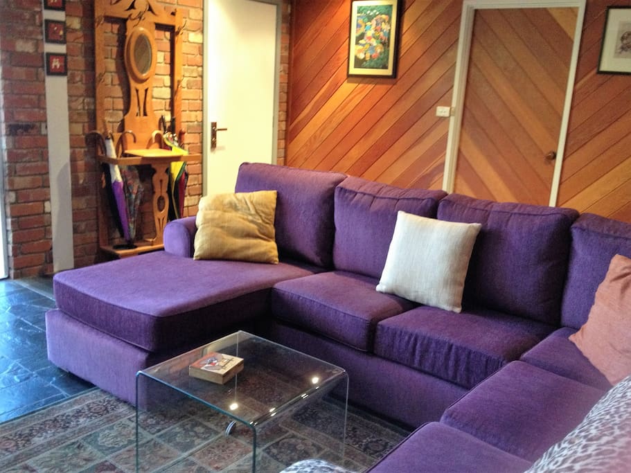 comfortable and ample lounge with views of the back garden