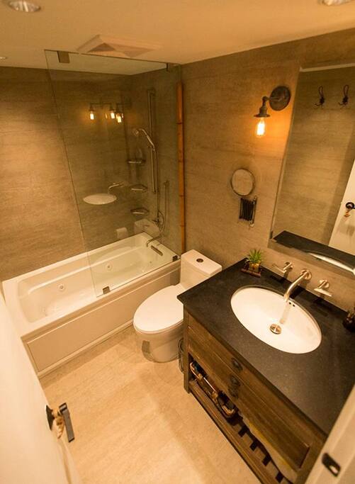 Enjoy this spa like bathroom with jacuzzi tub. The jets move around, so you can make sure you are alining all your right spots that ache or just need extra TLC. You will feel so relaxed, afterwards..