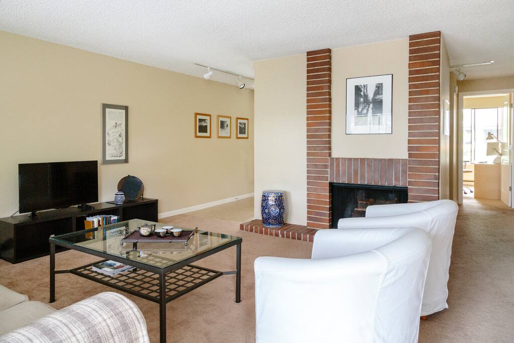 A wood-burning fireplace and fine-art photography are special touches.