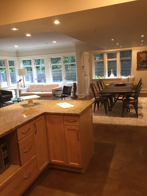 Looking from back of kitchen through to the front of house, livingroom and dining room.