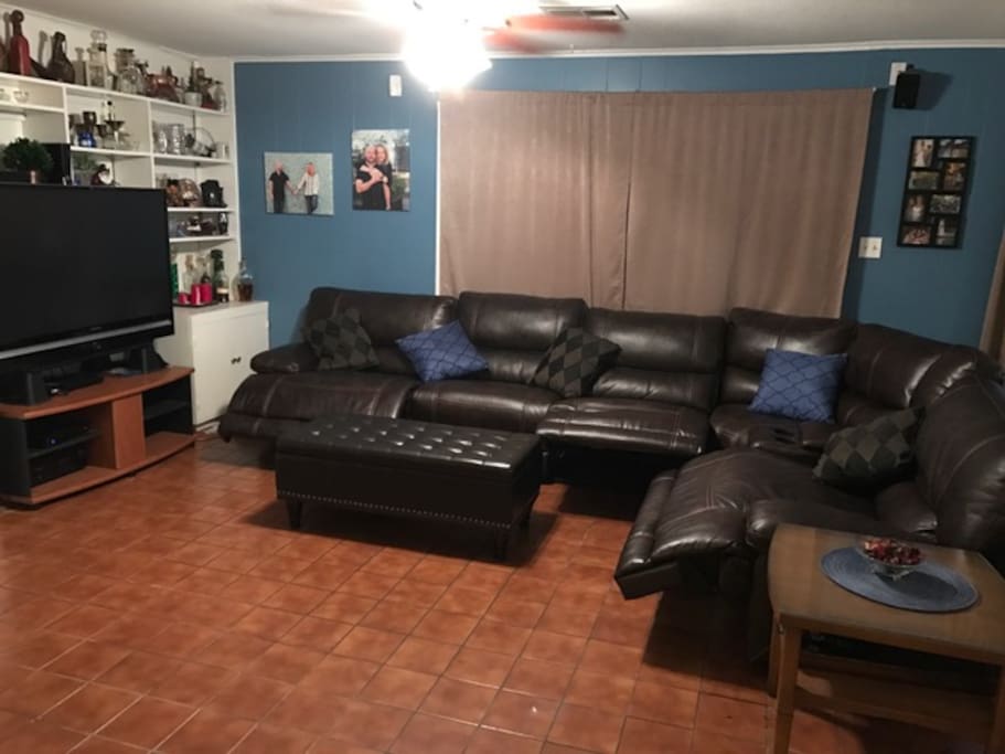 Recliner sectional with 55 inch TV with surround
