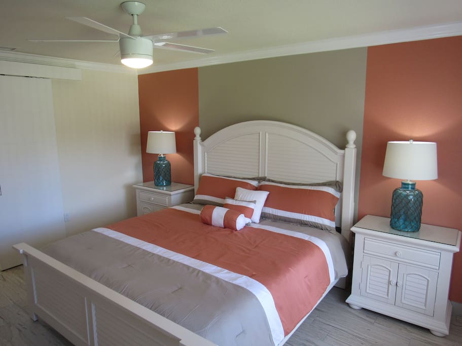 Master bedroom with king size bed and night stands