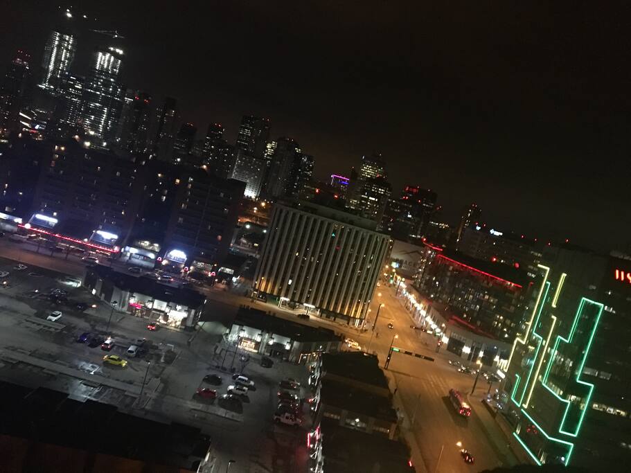 Night view of Jasper Ave + 109 st, from the corner of balcony : Central Social Hall is light up in yellow and green.