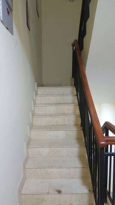 Stairways to the bedroom from the sitting room and dining room