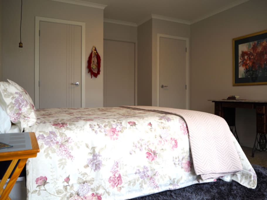Master bedroom suite with queen bed.