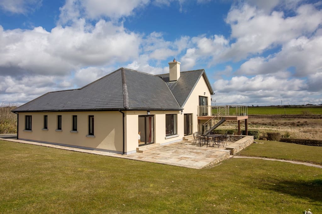 The exterior of the house with raised patio