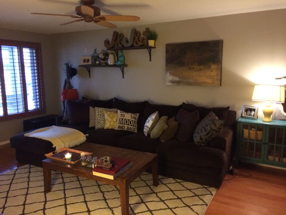 Living room with feather down couch and flat screen. Roku player has amazon prime, HBO and Netflix!