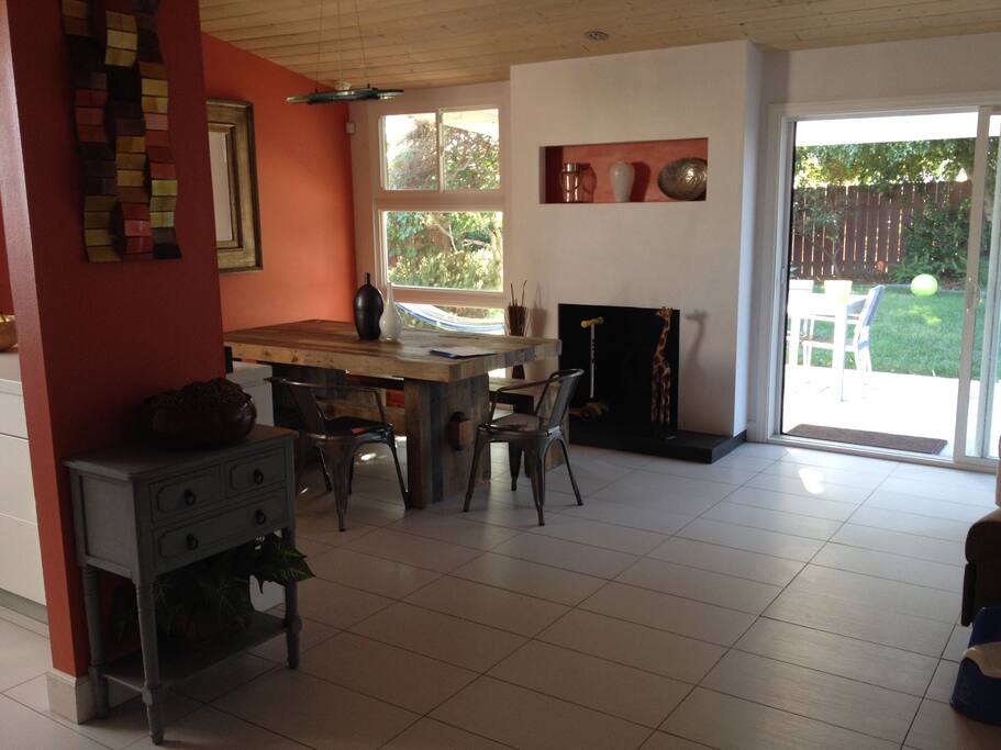 Full size wooden table and open floor plan.