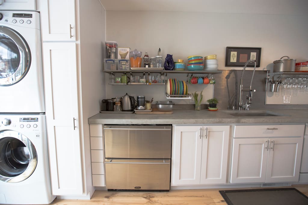 High end laundry and stocked kitchen with many upgraded appliances.