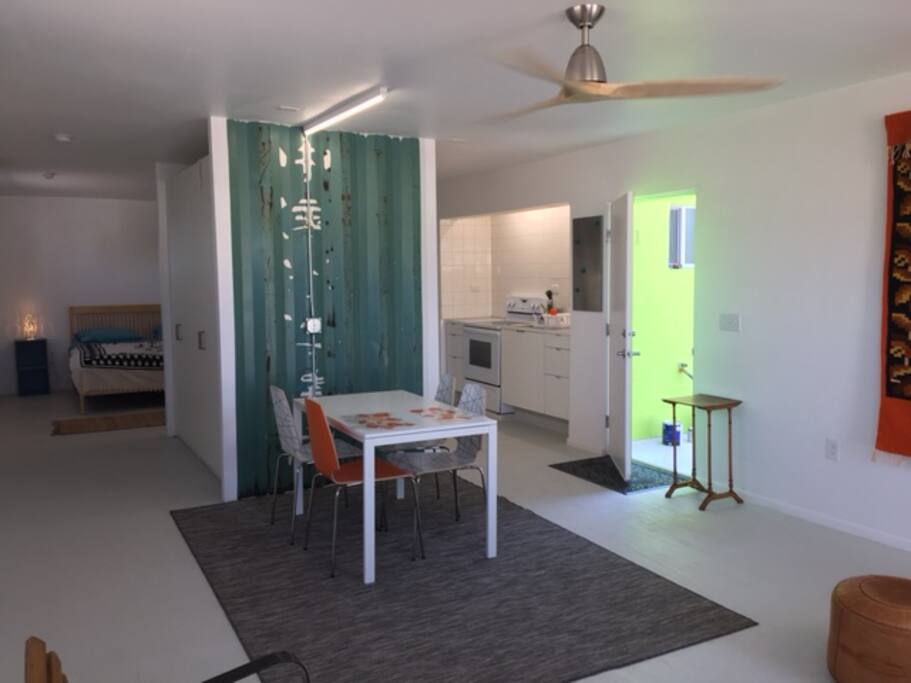 View from living room, kitchen to right, bedroom in back visible on left