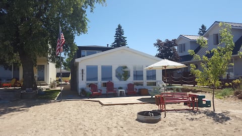 Waterfront home with sandy beach located in town