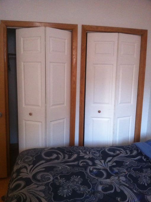Two full sized closets with hangers, hooks and space to store luggage. The room can easily accommodate two adults (or a young family).