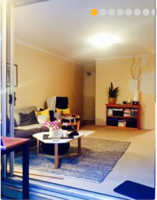 living area - excuse the colour swatches on the wall. It's all freshly painted now.