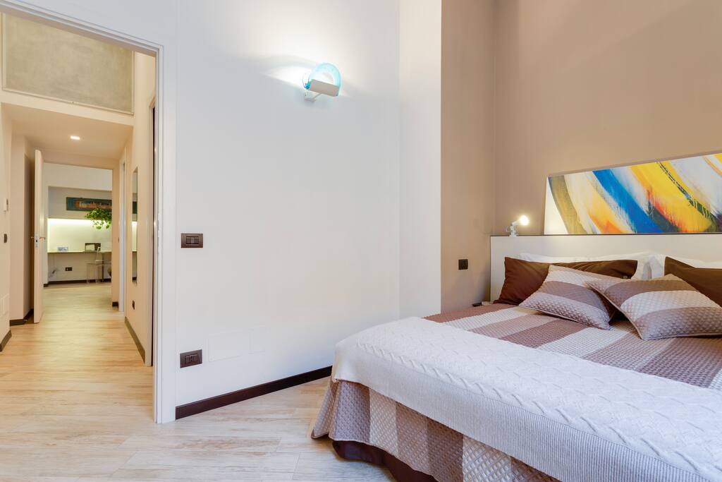 double bed room
A light brown shade placed over an understated grey undertone on one wall makes the room intimate and relaxing