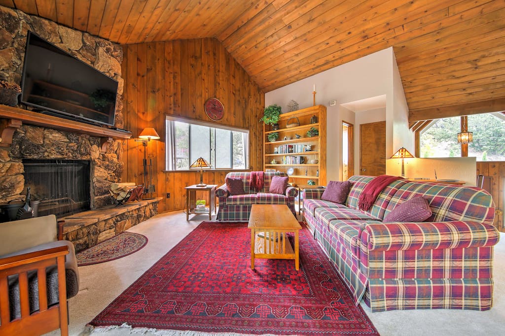 Step inside this 1,500-square-foot unit, featuring plush carpet, vaulted ceilings, comfortable furnishings and an open-concept floor plan.