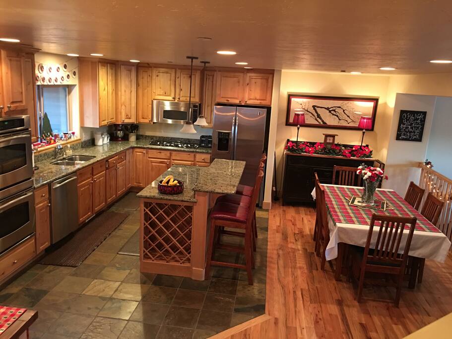 Fully equipped gourmet kitchen with stainless steel appliances, wet bar, double oven, coffee maker, instant boiling water faucet. Dining area and expandable table seats up to 16.