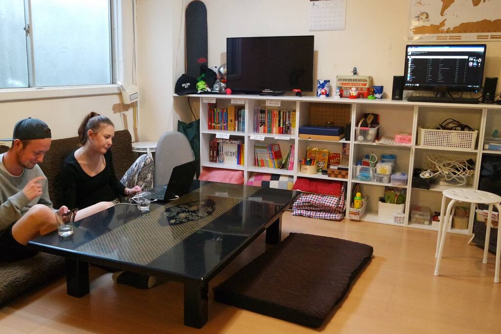 Living room with TV, PC, Game, Books etc