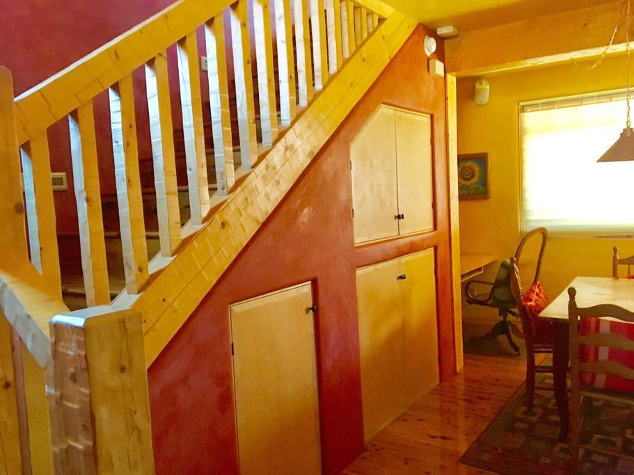 Staircase to upper level and built-in work area.