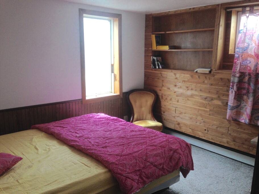 The Bedroom: Bed bookshelf, comfy chair, bedside table (in next photo)
