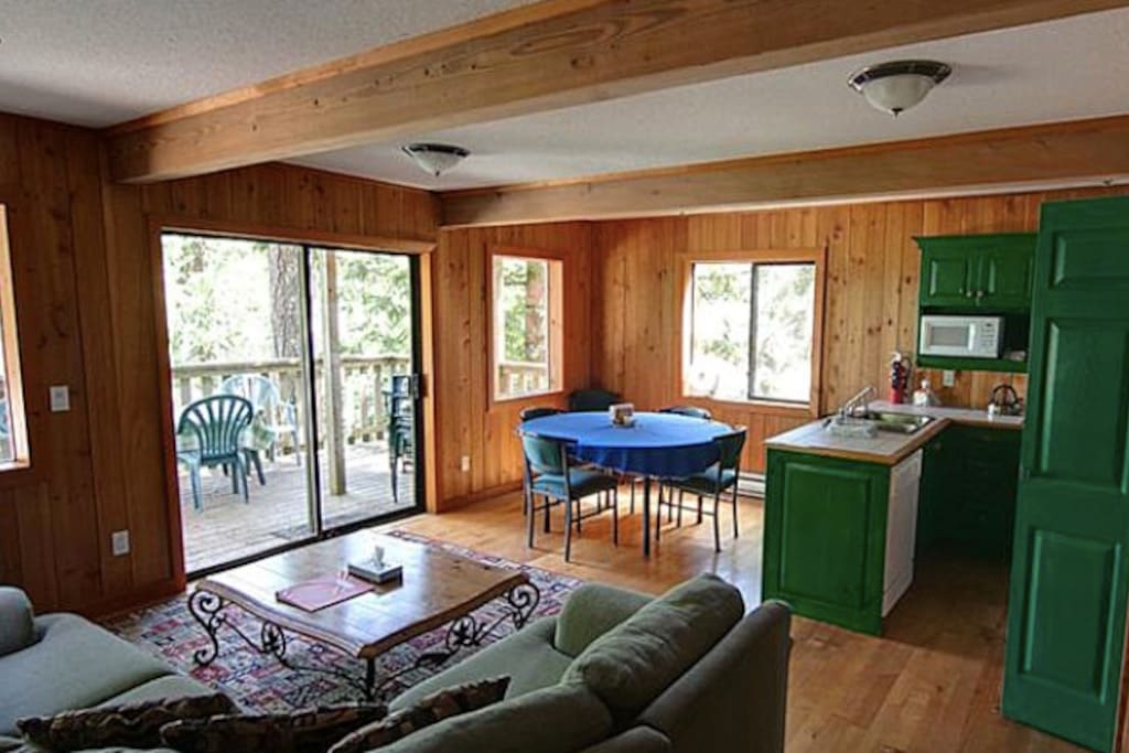 Bright, spacious living area and a private hot tub on the deck
