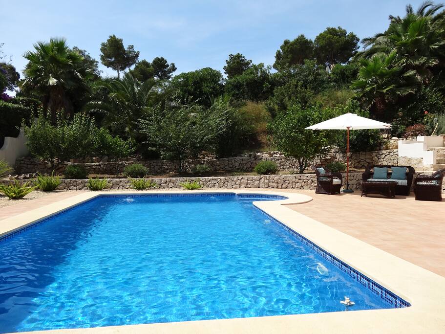 Inviting swimming pool in lovely garden.