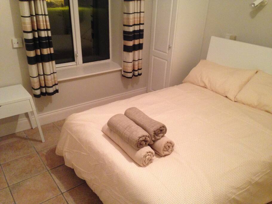 Double bedroom with ensuite large accessible bathroom.