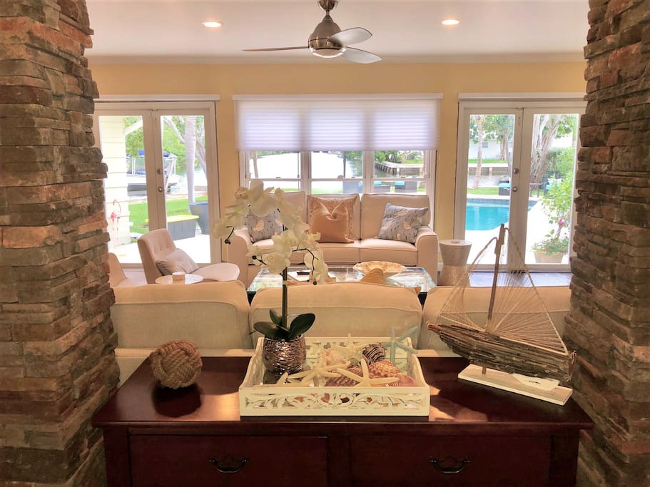 The living room features stylish but comfortable furniture and 65" HDTV.