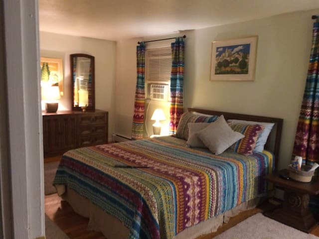 Warm, inviting room with two windows.