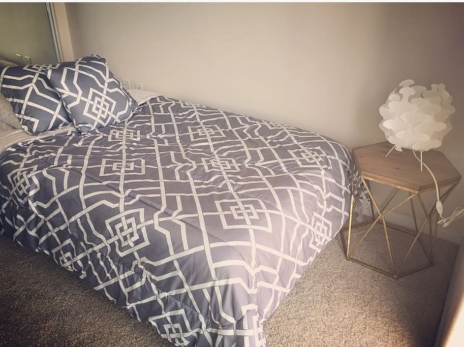 Bed and side table in listed bedroom