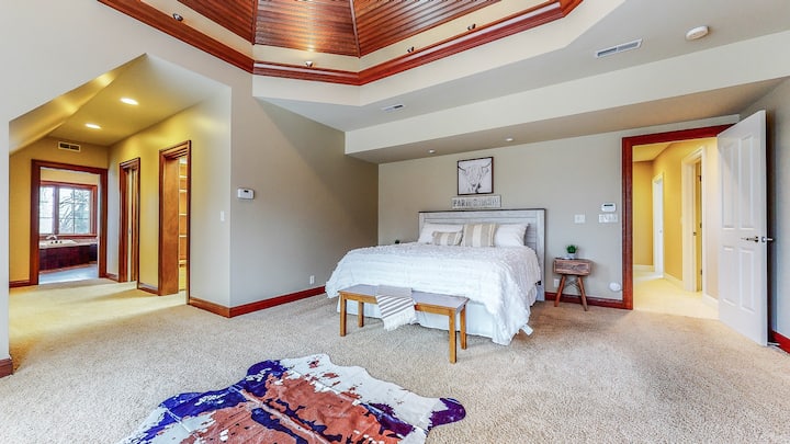 "Farm charm" master bedroom with king size bed, massive his and hers walk in closets, and en suite bathroom you'll have to see to believe. Located on the 2nd floor. 