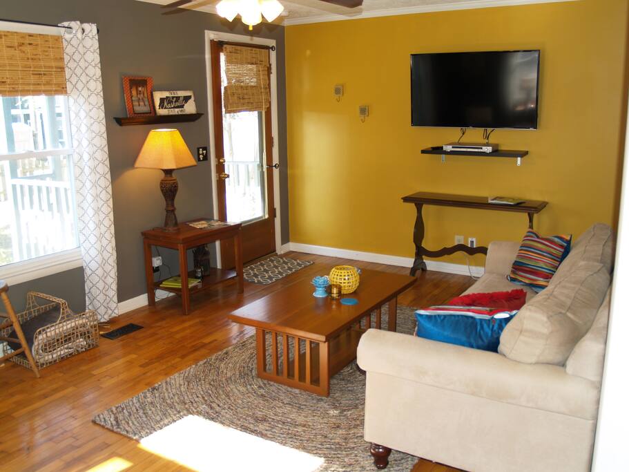 Bright, comfortable living room with ample seating for guests