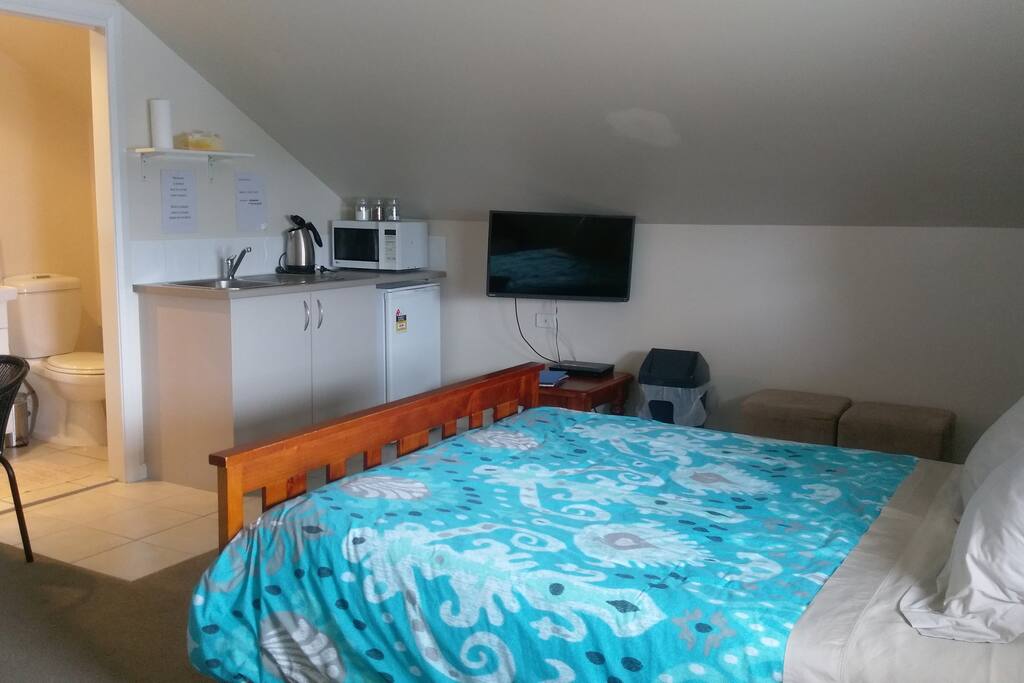 Queen bed and kitchenette