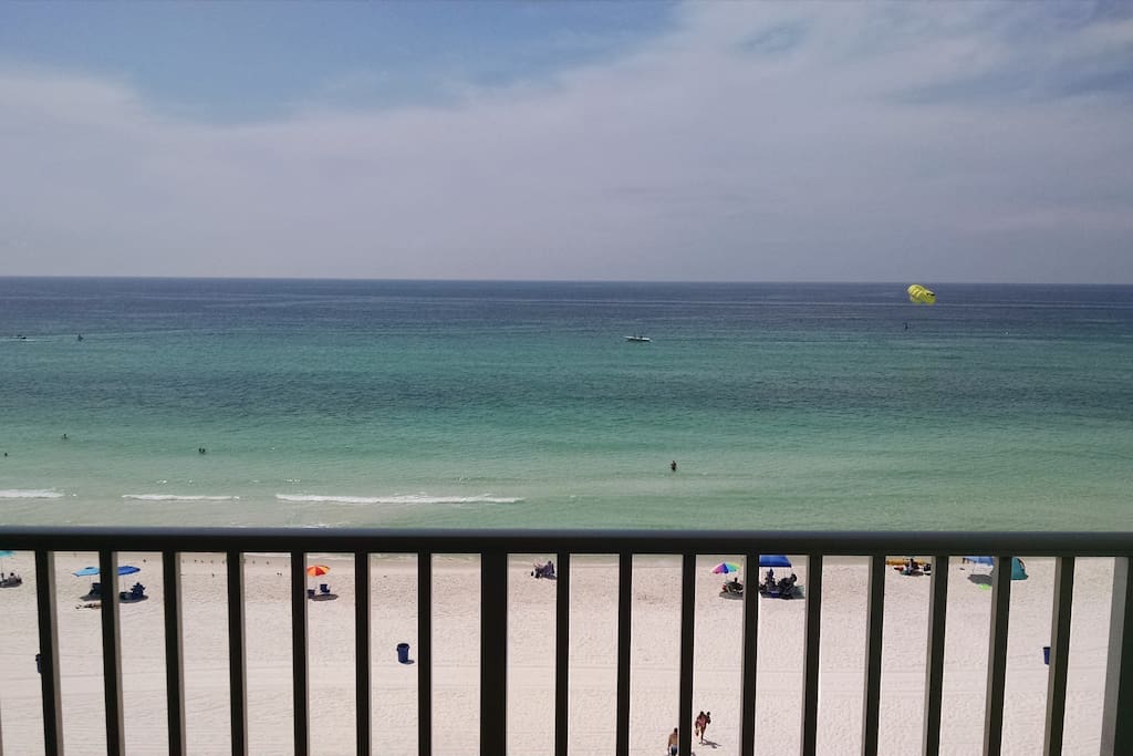 Balcony overlooking the white sand beach and Gulf of Mexico. See the sunrise and sunset from here. No obstructed view. The fishing pier can be seen in the distance, as well.