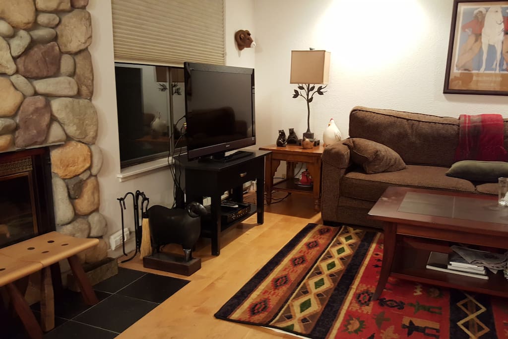 Wood-burning fireplace; river rock surround