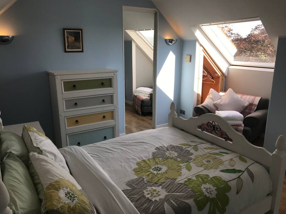 Look at the stars or listen to the rain while snug under the covers through full size skylight windows