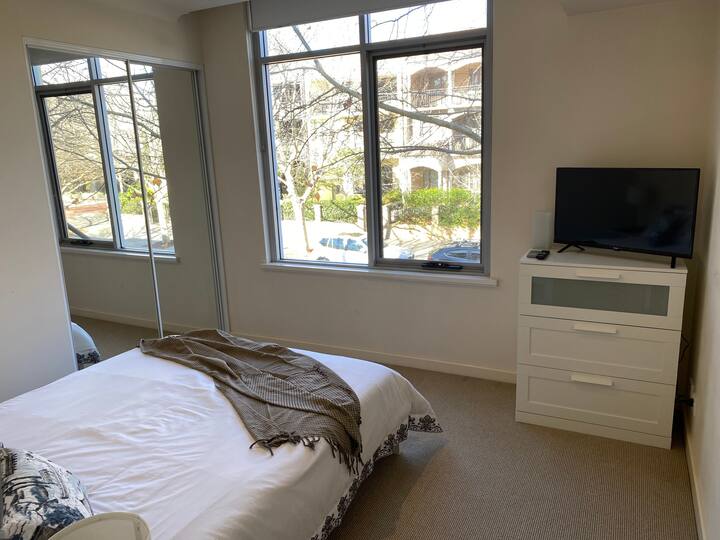 Main bedroom with view and Smart TV.