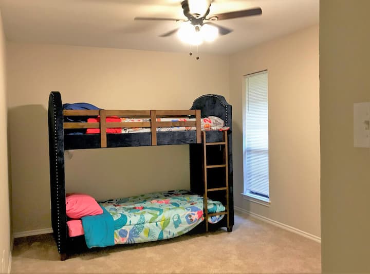 Bunk Bed Twin Size Bedroom.  Window lighting and comfortable beds.
