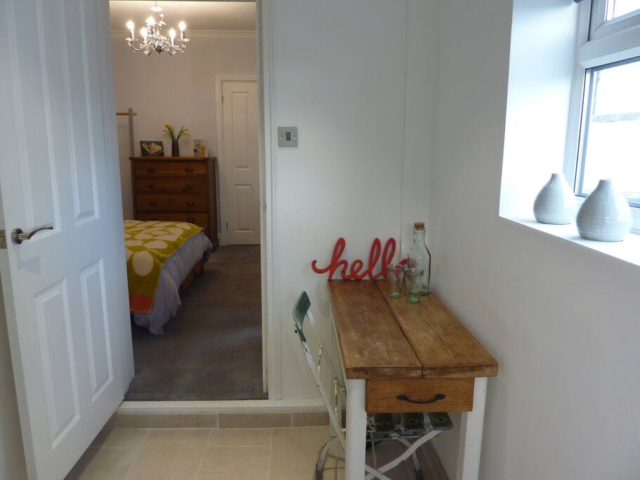 Entrance hall into bedroom and ensuite sauna and shower