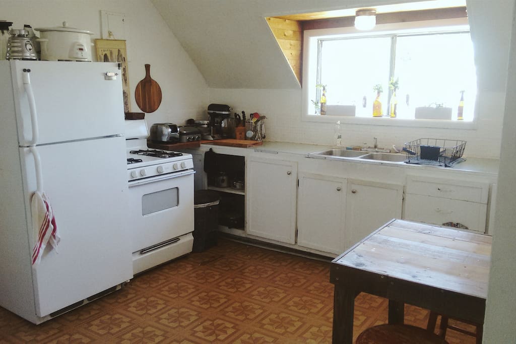 gas stove, professional cookware, dining space